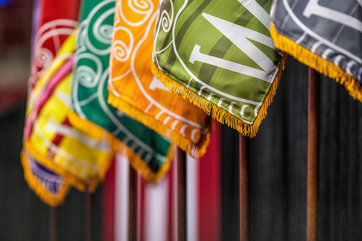 Flags flank the stage at the Chancellor's Convocation for New Students, at a Wisconsin Welcome event.