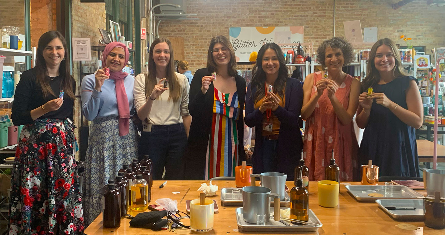 Group photo of seven members of the Q-HER team.