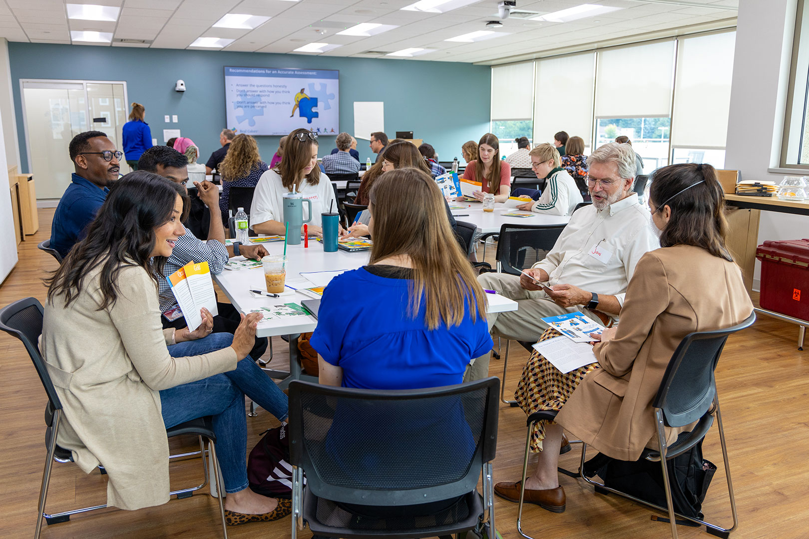 Research faculty and staff participate in a group activity at the department's Whitney Way office.