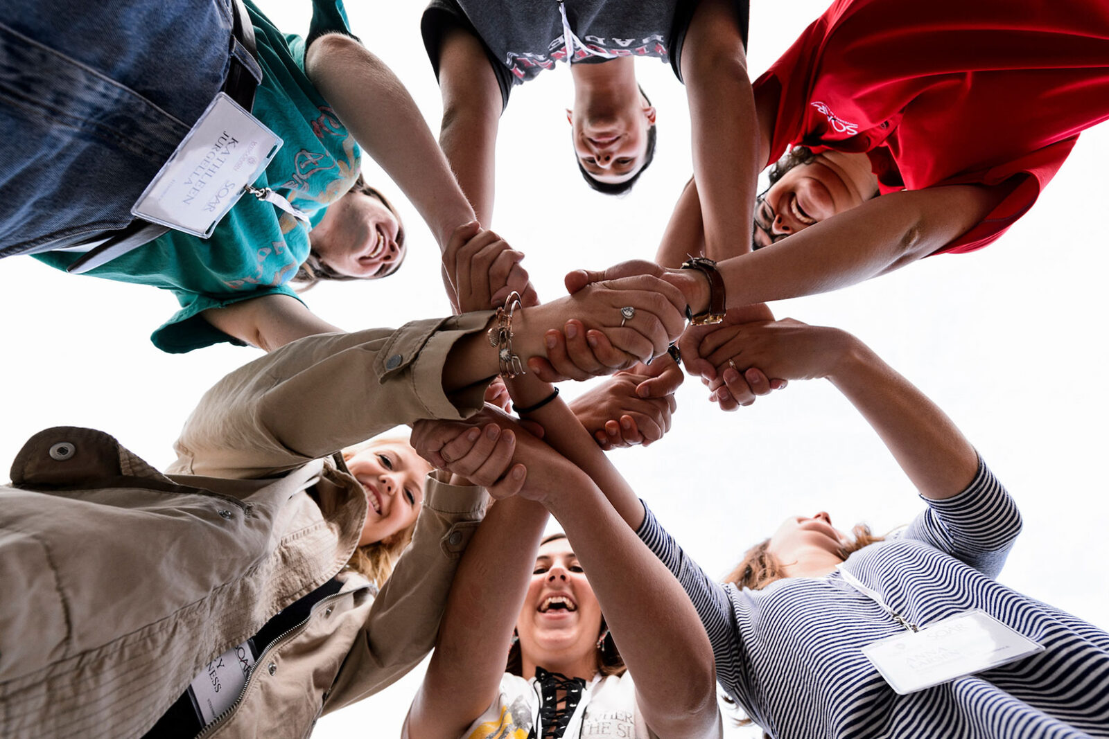 Incoming first-year undergraduates form a "human knot" showing team work.