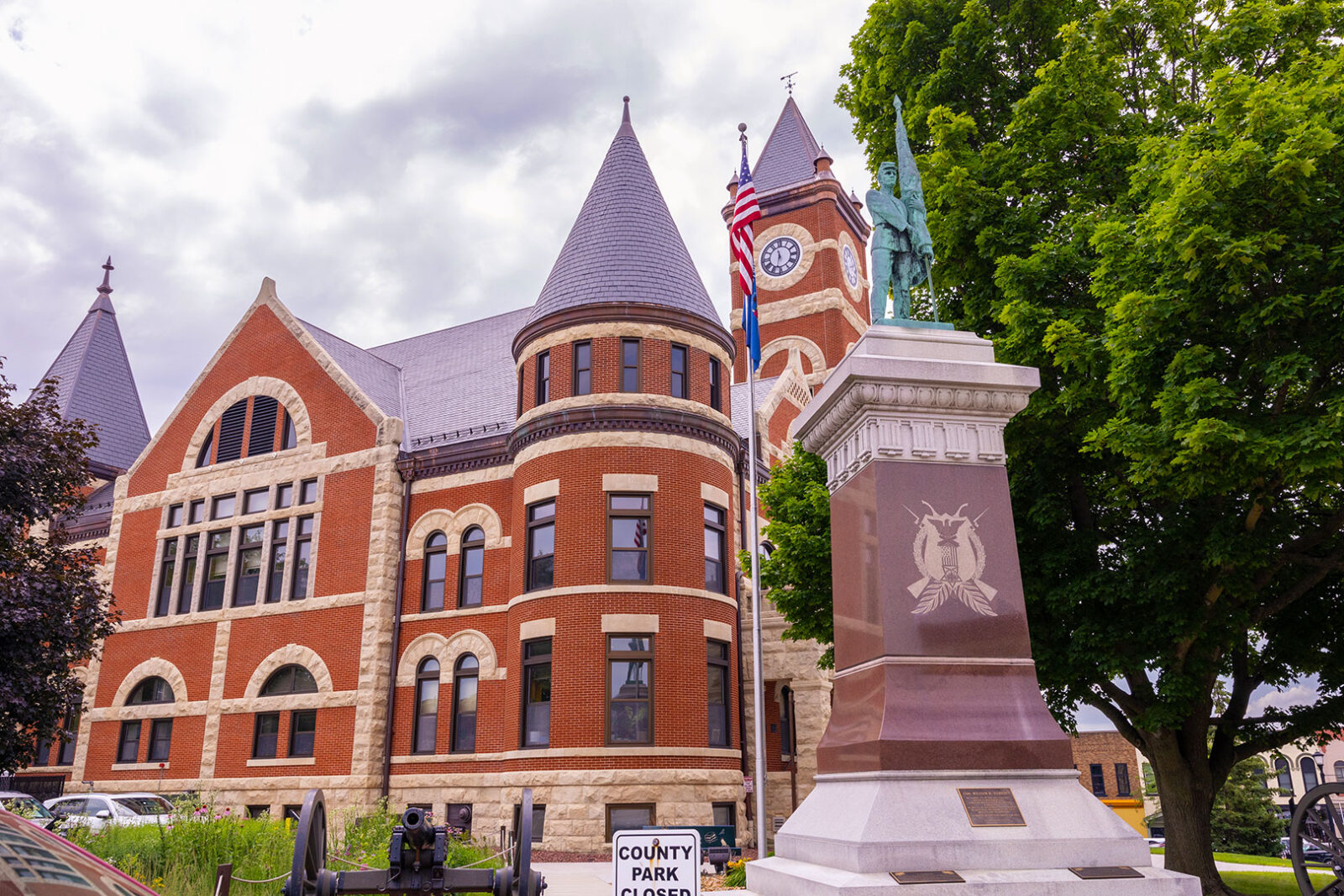 Brick building and statue in downtown Monroe, WI.