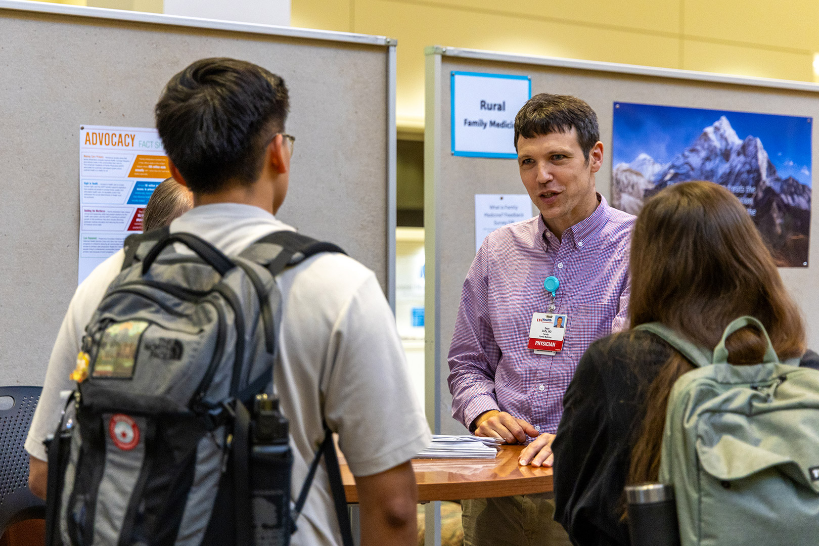 Faculty talk to medical students at a "What is Family Medicine" event.